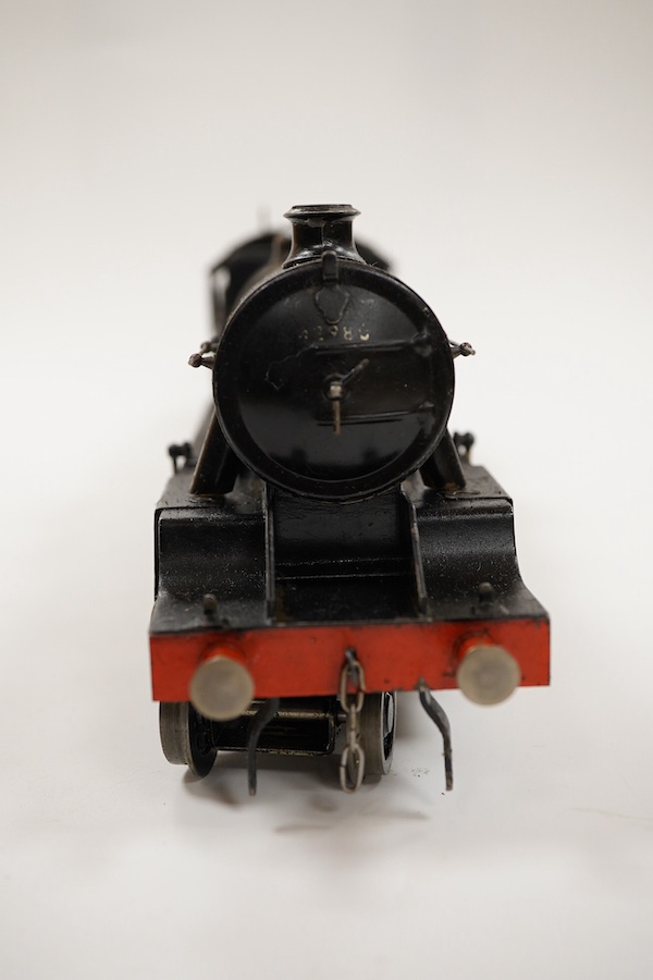 An 0 gauge Bassett-Lowke live steam spirit fired tinplate BR 2-6-0 Mogul tender locomotive, 42980, with original fuel tank and burner, two controls in the cab accessed through the cab roof